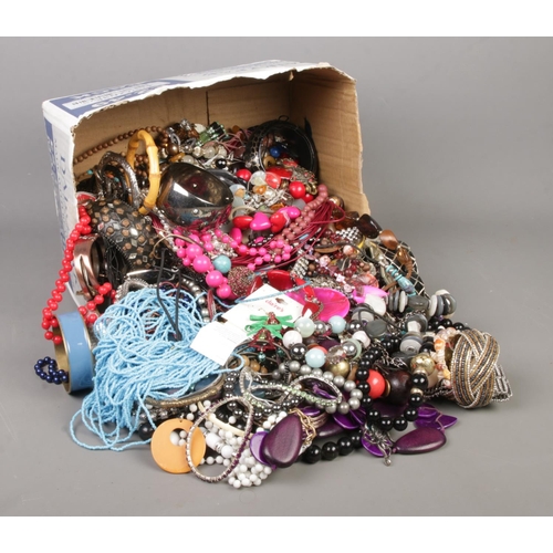 341 - A large box of costume jewellery, to include beaded necklaces, bangles, bracelets and earrings etc.