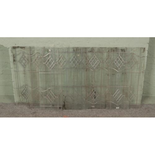 380 - A set of ten lead lined rectangular glass panels, with diamond design. Height: 69cm, Width: 28cm.