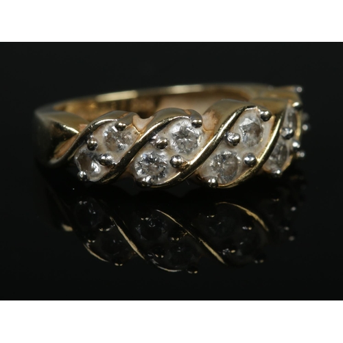 533 - An 18ct Gold and ten stone diamond ring, with the stones set in a rope twist setting. Size K. Total ... 