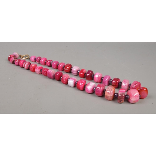 545 - A large graduated beaded agate necklace. 71cm unclasped.