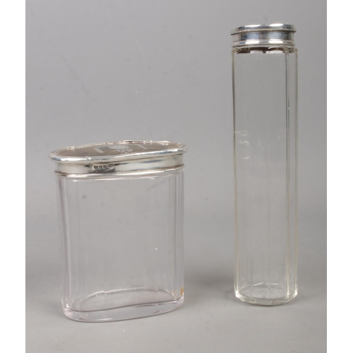 578 - Two silver and tortoiseshell topped glass dressing table jars. Assayed for London, 1912.