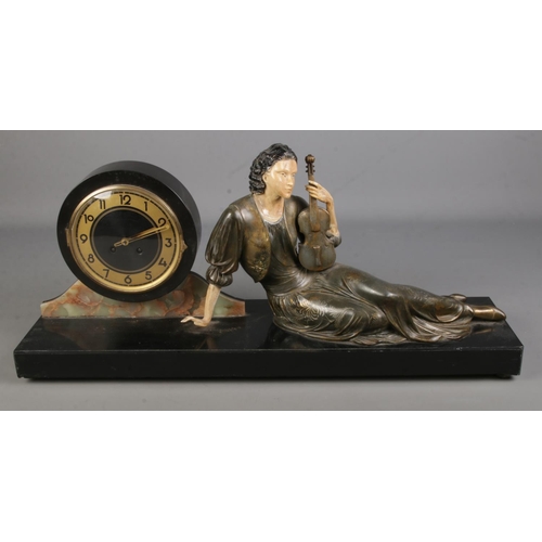 109 - A large Art Nouveau style slate figural mantel clock. Formed as a seated maiden holding a violin. (3... 