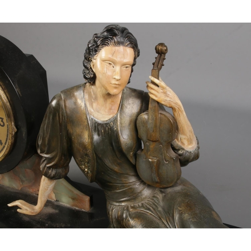 109 - A large Art Nouveau style slate figural mantel clock. Formed as a seated maiden holding a violin. (3... 