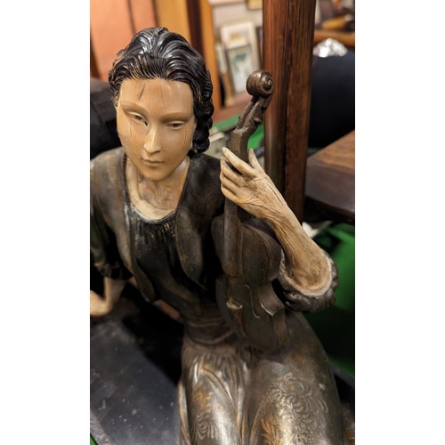 109 - A large Art Nouveau style slate figural mantel clock. Formed as a seated maiden holding a violin. (3... 