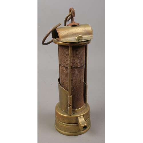 100 - A brass miners Davy lamp, Stamped JM to the top. Possible mark for J.Ullathorn.