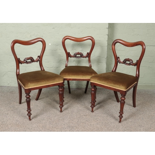 556 - A set of six Victorian mahogany dining chairs.