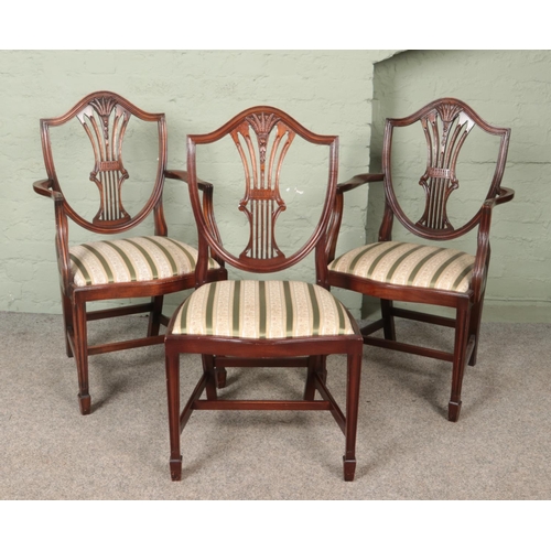 557 - A set of six Rackstraw style dining chairs, including two carvers.