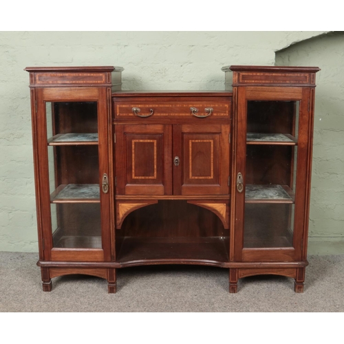 559 - An Edwardian inlaid mahogany breakfront side cabinet.