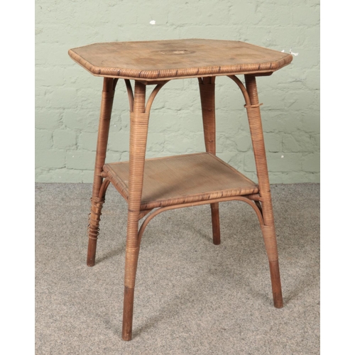 562 - A Maple & Co bamboo occasional table.