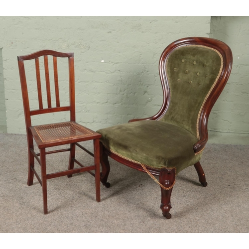 576 - A Victorian upholstered mahogany spoon back chair along with a bergere seat chair.