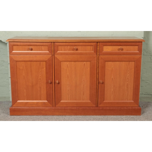 585 - A modern teak G-Plan sideboard, model DAV 040, with three drawers above cupboard doors. Height: 85cm... 