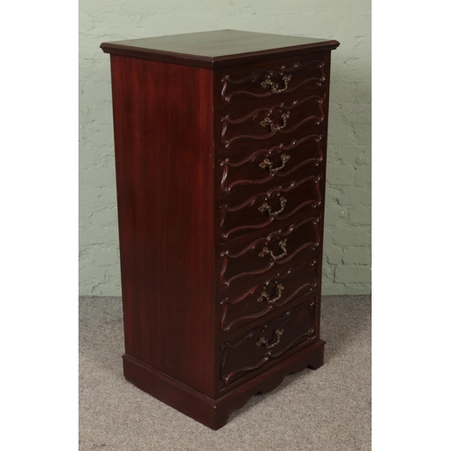 595 - A French style mahogany semainier featuring scroll molding and gilt handles. lined in camphor wood. ... 