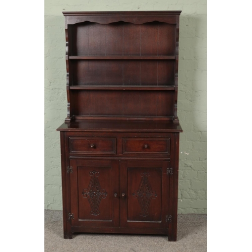 599 - A Hallmark by Foster-Binder dresser featuring carved detail to doors. Approx. dimensions 92cm x 45cm... 