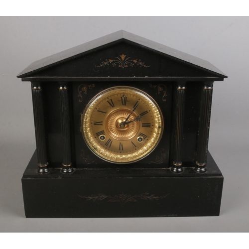 105 - A slate 8 day mantel clock with gilt dial. (33cm x 37cm)