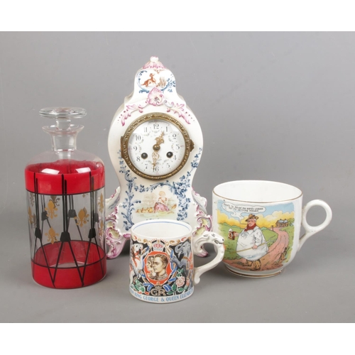 115 - A collection of ceramics and glass. Includes Longwy mantel clock, Laura Knight coronation cup, Tykes... 