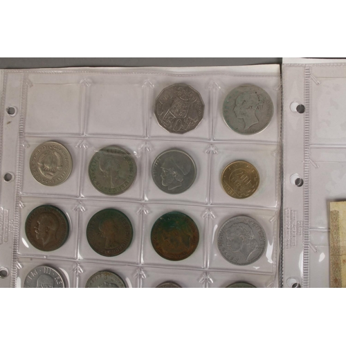 126 - A folder of assorted world coins including English with Victorian half crown 1879, American, French,... 