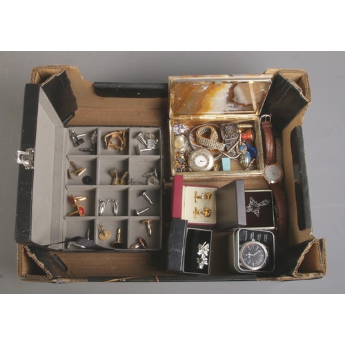 142 - A box of jewellery. Includes Cardinal pocket watch, wristwatches, cuff links, brooches, etc.