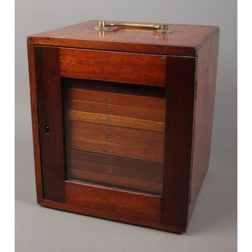 148 - A small mahogany specimen cabinet with glazed door featuring fourteen fitted drawers. Approx. dimens... 