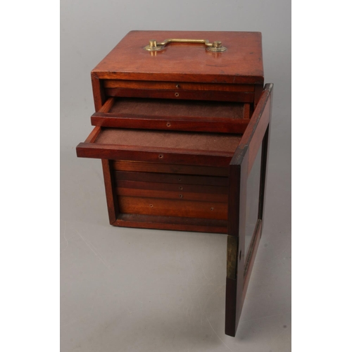 148 - A small mahogany specimen cabinet with glazed door featuring fourteen fitted drawers. Approx. dimens... 