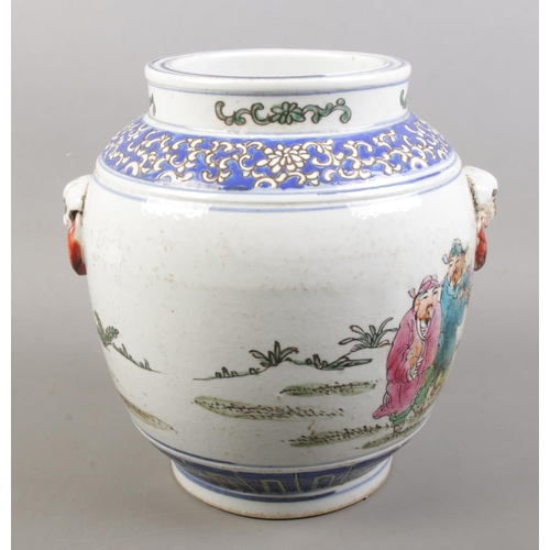 152 - A Chinese hand painted twin handle vessel. Decorated with figures and blue & white fish to the insid... 