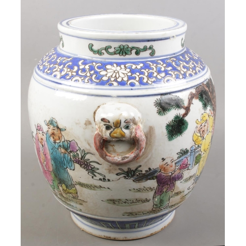 152 - A Chinese hand painted twin handle vessel. Decorated with figures and blue & white fish to the insid... 