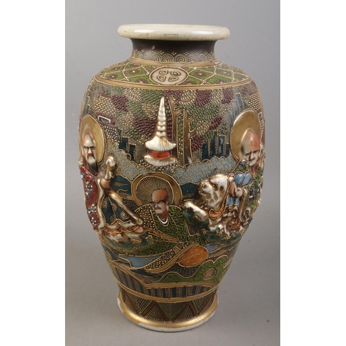 155 - A Japanese hand painted satsuma vase. Decorated with figures and animals. (31cm)