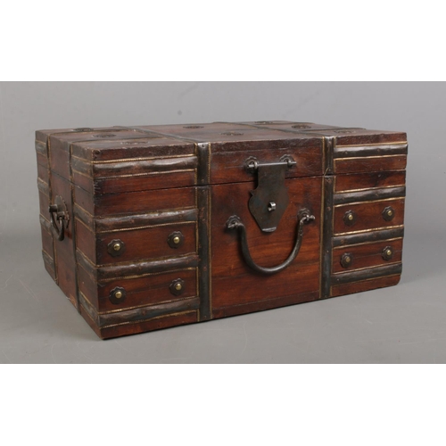 160 - A small Eastern style metal bound wooden chest with hinged top. Height: 20cm, Width: 40cm, Depth: 30... 