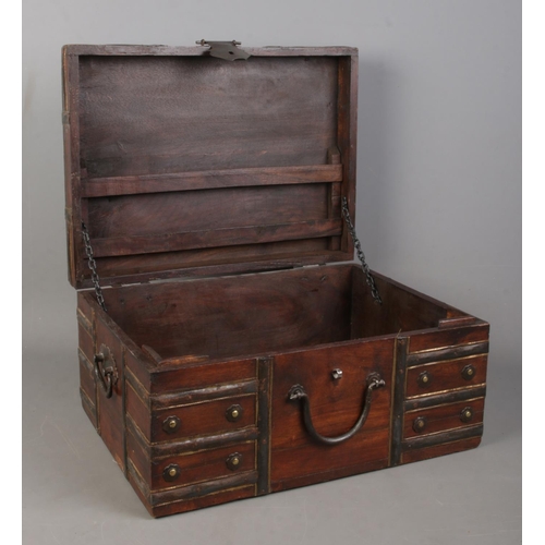 160 - A small Eastern style metal bound wooden chest with hinged top. Height: 20cm, Width: 40cm, Depth: 30... 