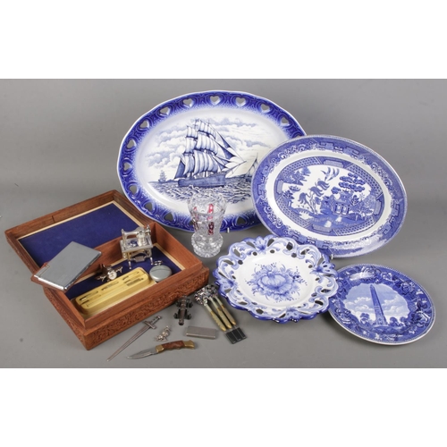 214 - A box of miscellaneous. Includes blue and white ceramics, carved wooden box with collectables; cigar... 