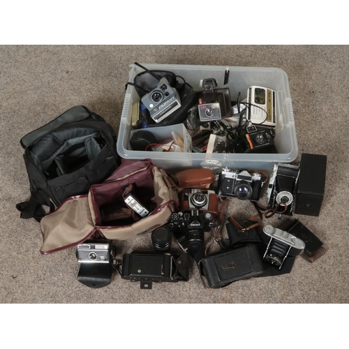 218 - A box of photographic equipment. Includes cameras; Coronet Rapide, Kershaw 110, Zenit 11, Zenit E et... 