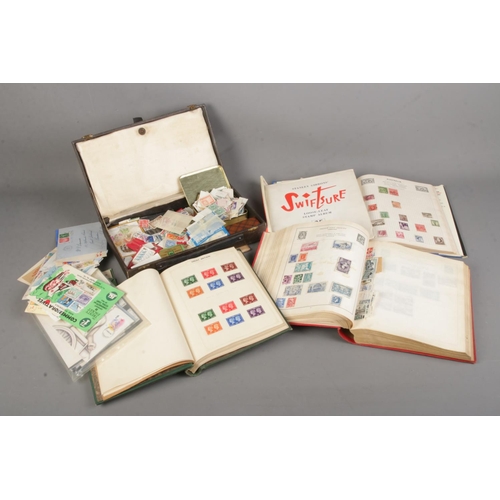 220 - A large collection of stamps from around the world in several albums including some mint examples an... 