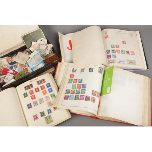 220 - A large collection of stamps from around the world in several albums including some mint examples an... 