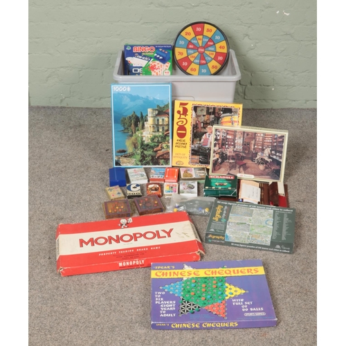 222 - A box of assorted games, toys and cards. To include jigsaws, Monopoly, Mastermind and Chinese Checke... 