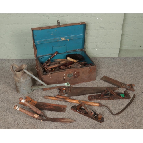 223 - A vintage tin trunk with contents of tools along with a galvanised watering can. Includes Stanley pl... 