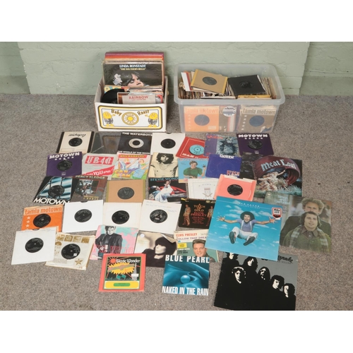 230 - Two boxes of mostly single records. Includes Queen, Elvis, Meat Loaf, UB40, Stevie Wonder, etc.