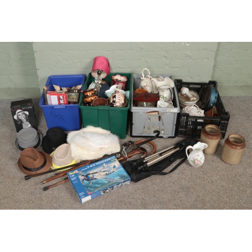 233 - Four boxes of miscellaneous. Includes walking sticks with white metal mounts, wall clock, hats, ston... 