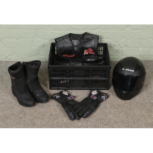 235 - A box of motorbiking equipment. Includes LS2 helmet, Diamond Plate leather waist coat, etc.