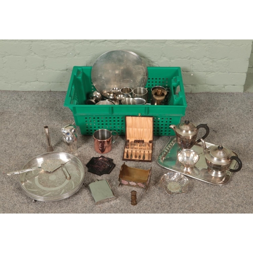 265 - A box of metalwares. Includes silver plate trays, teapots, tankards, hipflasks, etc.