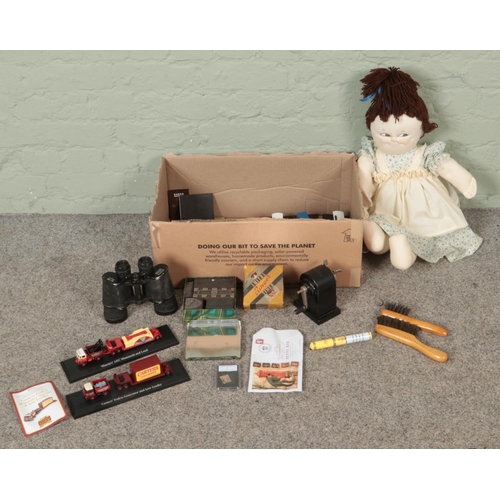 268 - A large box of collectables. Includes Zenith binoculars, Atlas Editions diecast models, The Imperfor... 