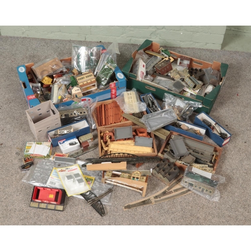 288 - Three boxes of model railway accessories. Includes Hornby platform straights and station buildings, ... 