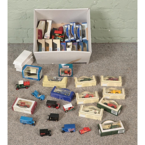 291 - A box of assorted diecast vehicles to include Days Gone, Tetley, Lledo, etc.