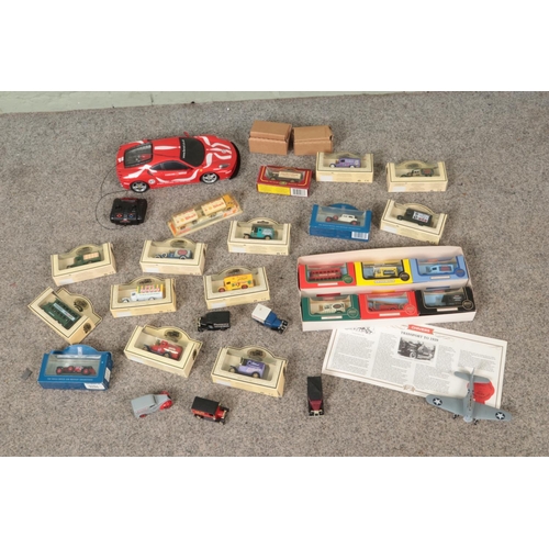 292 - A box of assorted diecast vehicles to include New Bright Remote Control Ferrari, Days Gone, Lledo, C... 