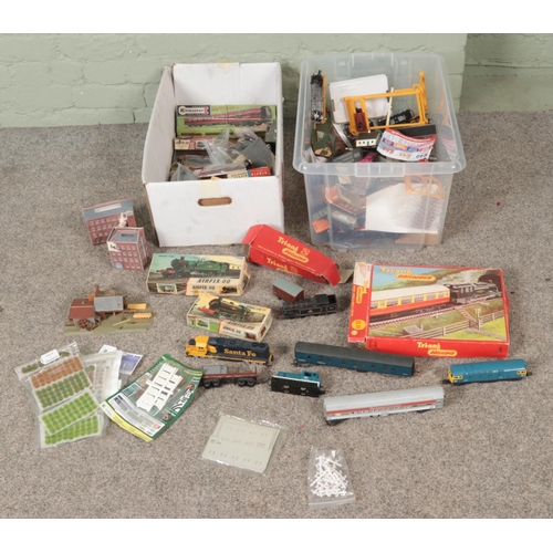 293 - Two boxes of assorted model railway accessories, locomotives, scenery, etc. To include Tri-Ang boxed... 