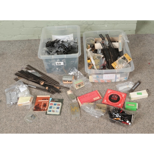 296 - Two boxes of assorted model railway spares, repairs and accessories to include locomotive engines, t... 