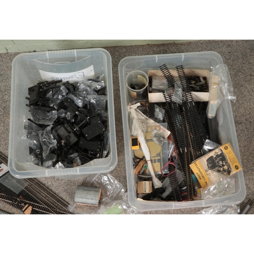 296 - Two boxes of assorted model railway spares, repairs and accessories to include locomotive engines, t... 