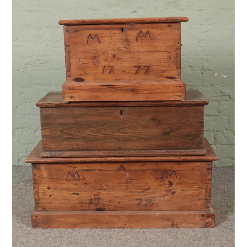 298 - Three hinged top pine chests, two with MM 1777 branded to the front.