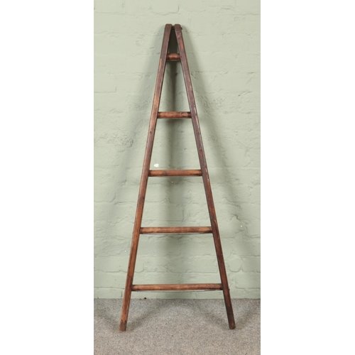 306 - A five rung wooden A-Frame ladder, possibly for fruit picking. Height: 137cm.