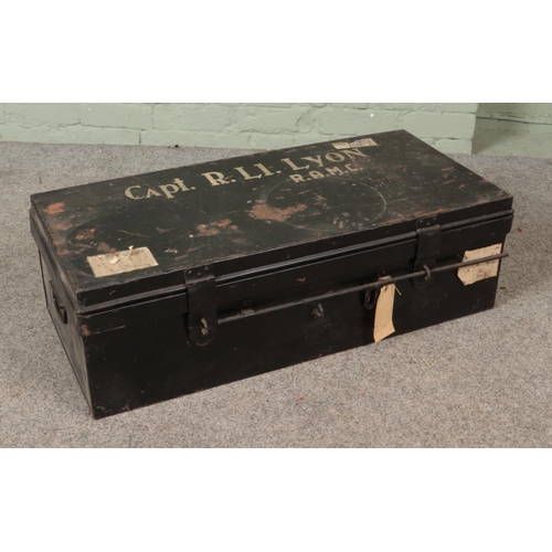 308 - A military Royal Army Medical Core black painted tin trunk stenciled for Capt. R. Li. Lyon (R.A.M.C)... 