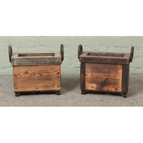 312 - A near pair of miniature log/kindling baskets with metal surrounds.