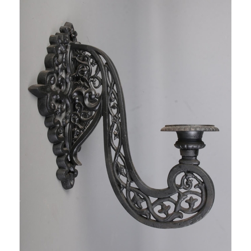 314 - A pair of cast iron black wall mounted sconces 

Hx50cm approx